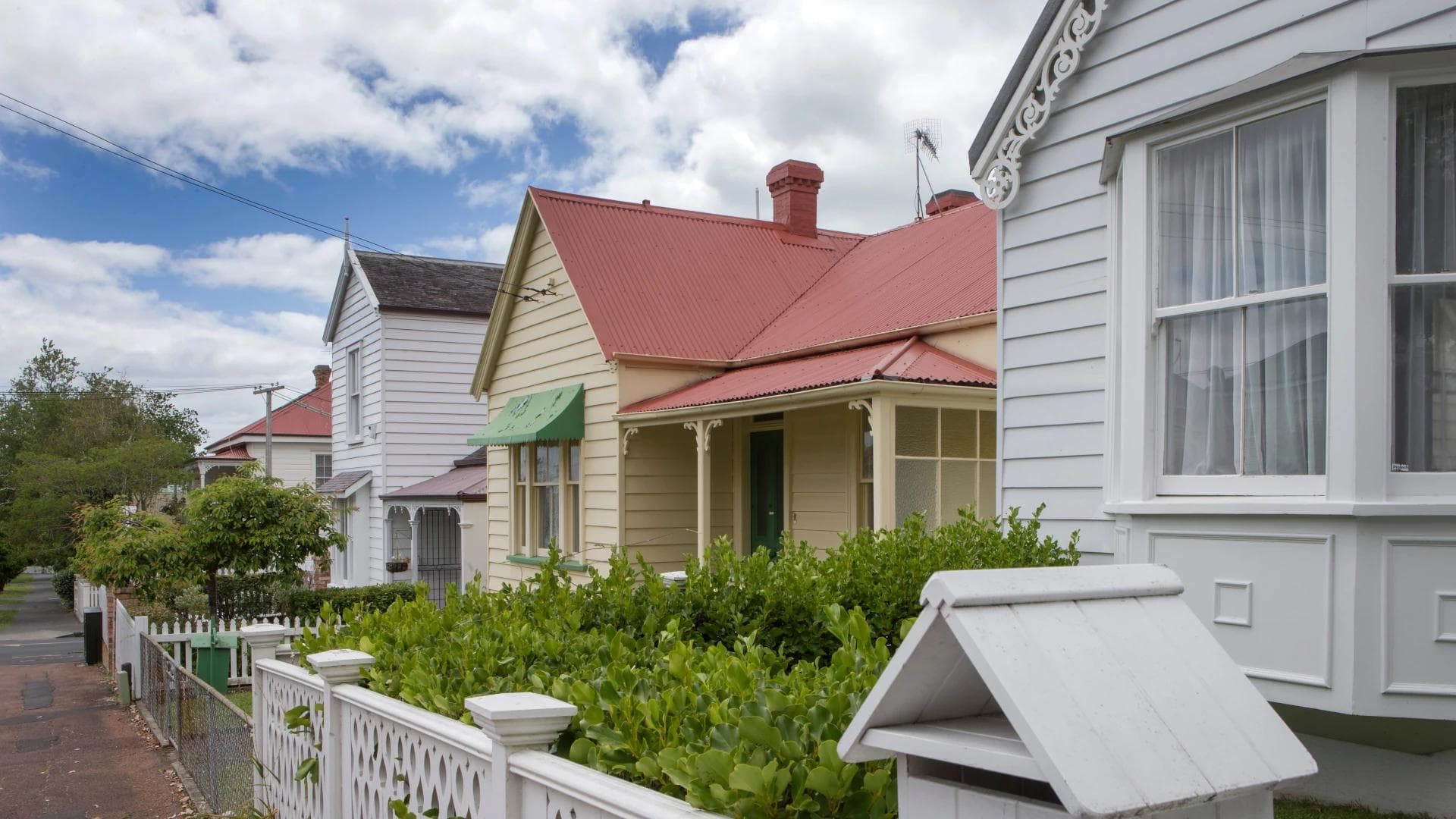 A row of houses on a street.